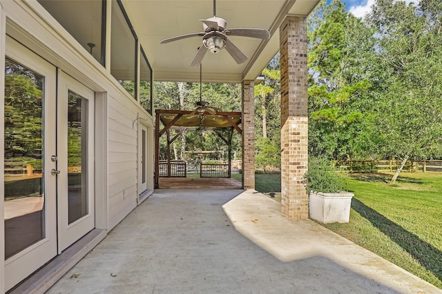 view of patio with french doors and ceiling fan