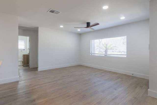 spare room featuring light hardwood / wood-style flooring and ceiling fan