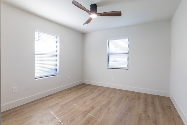 empty room featuring ceiling fan and light wood-type flooring