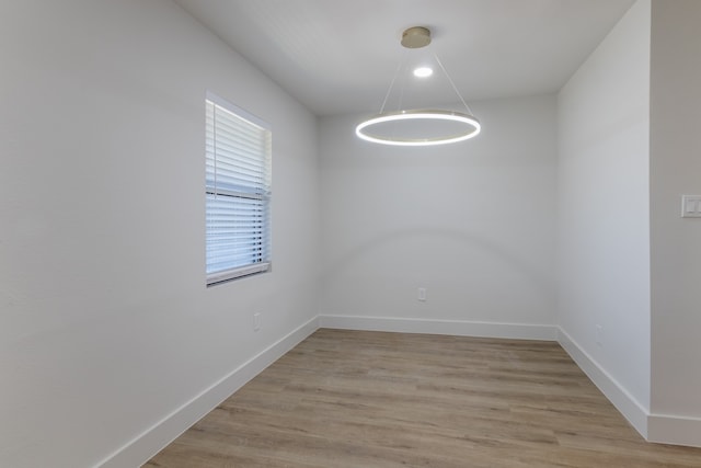 spare room with light hardwood / wood-style floors