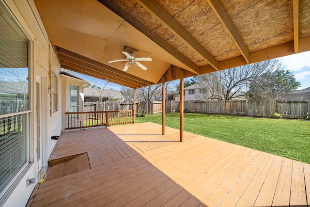 wooden deck featuring a fenced backyard, ceiling fan, and a yard