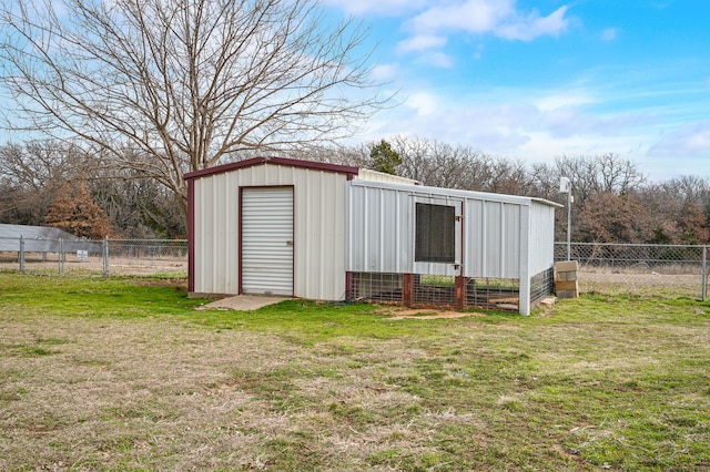 view of outbuilding with a yard