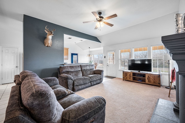 living room featuring lofted ceiling, plenty of natural light, light colored carpet, and ceiling fan