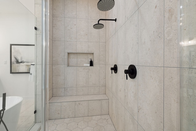 bathroom featuring shower with separate bathtub