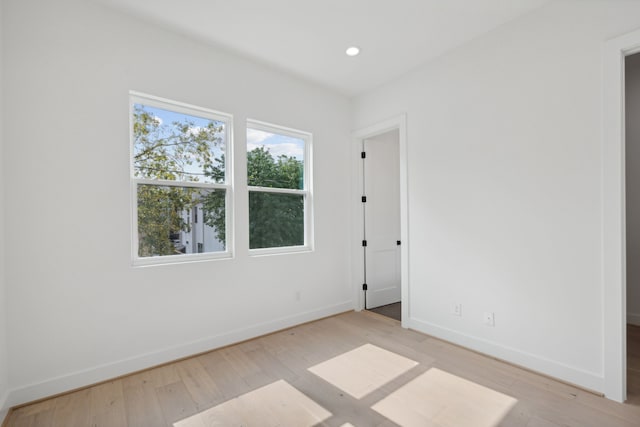 empty room with light hardwood / wood-style floors