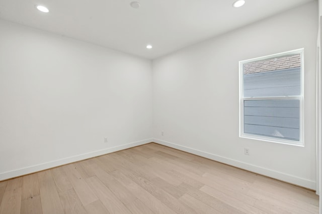 spare room featuring light wood-type flooring