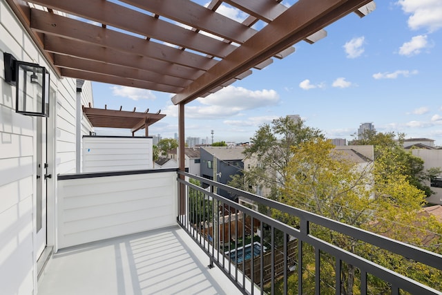 balcony featuring a pergola