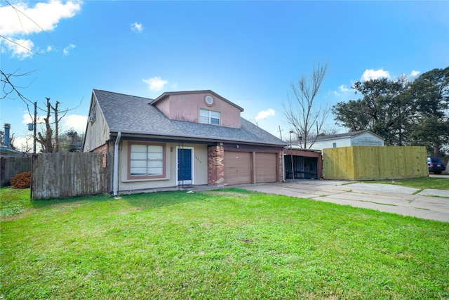 view of front of property featuring a garage and a front yard