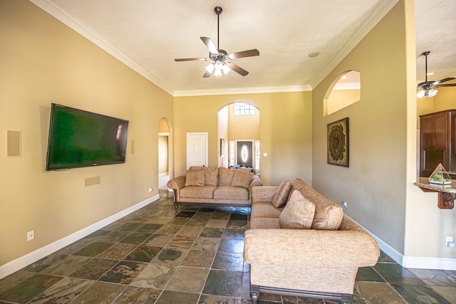 living room with crown molding and ceiling fan