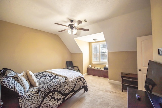 carpeted bedroom with ceiling fan, lofted ceiling, and a textured ceiling