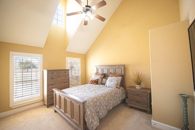 bedroom featuring high vaulted ceiling, light colored carpet, and ceiling fan