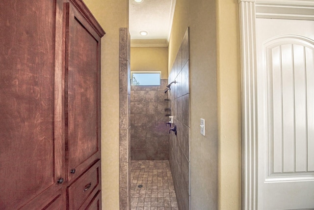 bathroom with tiled shower