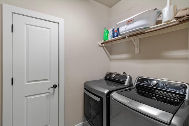 washroom featuring washer and clothes dryer