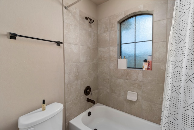 bathroom with shower / bath combination with curtain and toilet