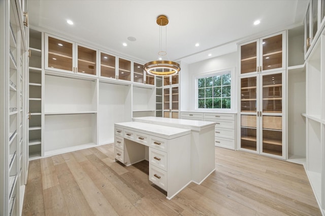 spacious closet with light hardwood / wood-style floors