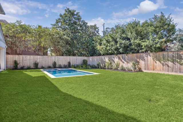 view of yard with a fenced in pool