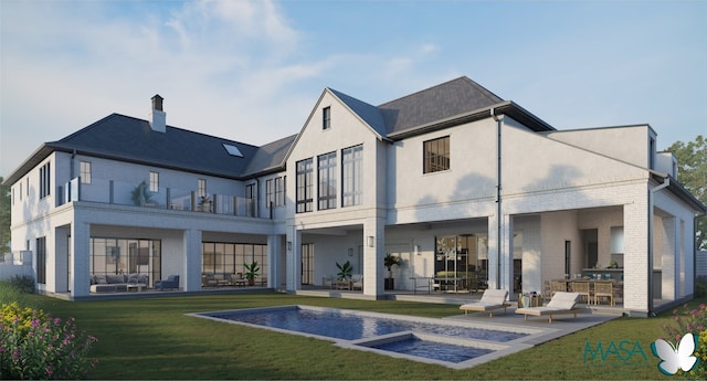 rear view of house with a yard, a patio area, and a balcony