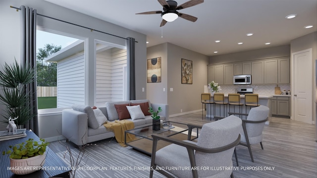 living area featuring a ceiling fan, recessed lighting, light wood-style floors, and baseboards