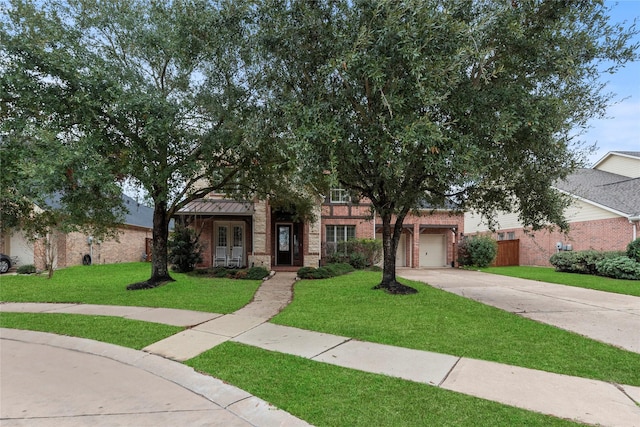 obstructed view of property featuring a front lawn