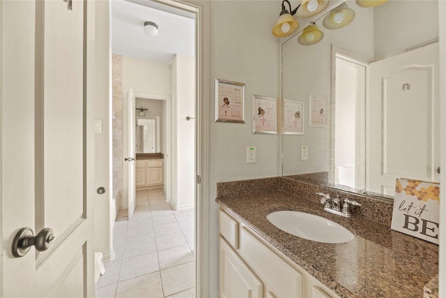 bathroom with tile patterned flooring and vanity