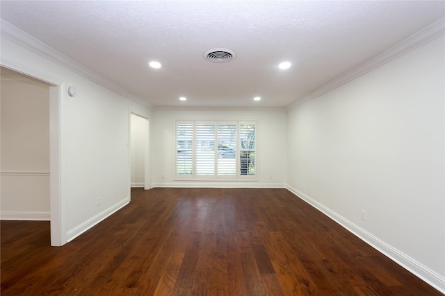 empty room featuring crown molding, a textured ceiling, and dark hardwood / wood-style flooring