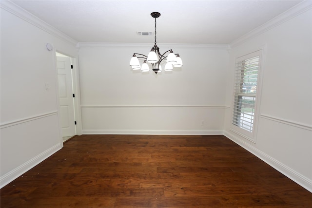 unfurnished dining area with dark wood-type flooring, ornamental molding, and a chandelier