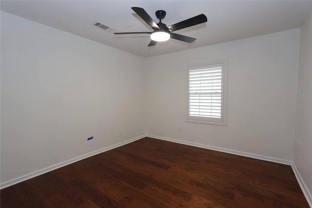 empty room featuring dark hardwood / wood-style floors and ceiling fan