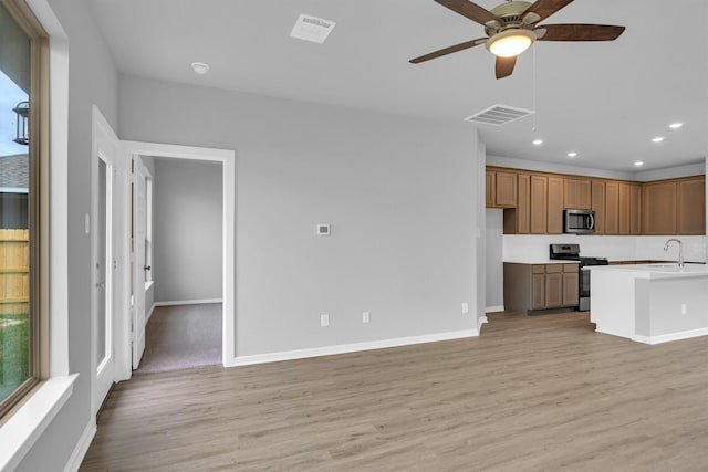 kitchen with recessed lighting, visible vents, light wood-style flooring, and stainless steel appliances