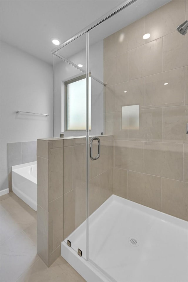 full bath featuring a shower stall and a bath