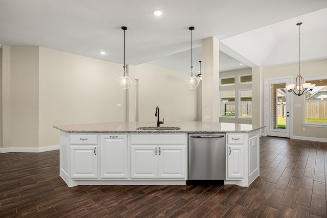 kitchen with dishwasher, wood finish floors, plenty of natural light, and a sink