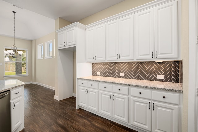 kitchen with pendant lighting, dark wood finished floors, backsplash, white cabinets, and dishwasher