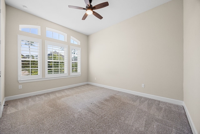 unfurnished room with ceiling fan, carpet floors, and baseboards