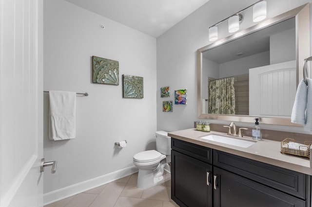 bathroom featuring tile patterned flooring, toilet, a shower with shower curtain, vanity, and baseboards