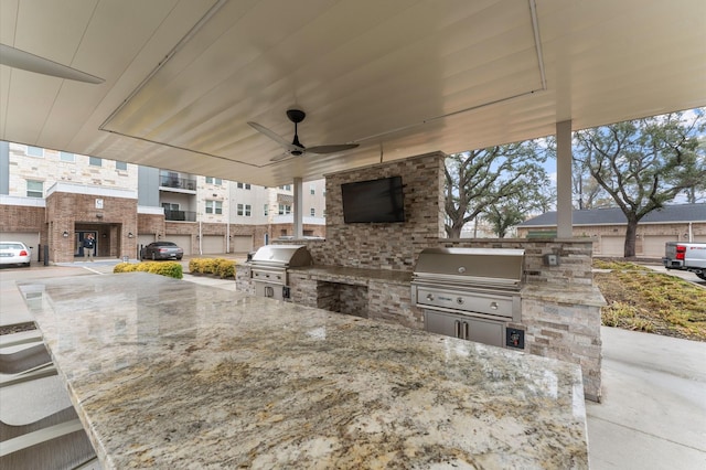 view of patio / terrace with ceiling fan, an outdoor kitchen, and grilling area