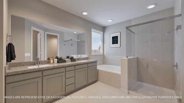 bathroom featuring vanity, tile patterned floors, and shower with separate bathtub