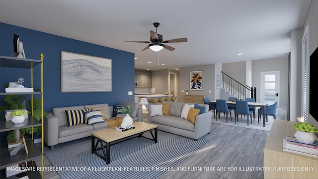 living room featuring ceiling fan and hardwood / wood-style floors