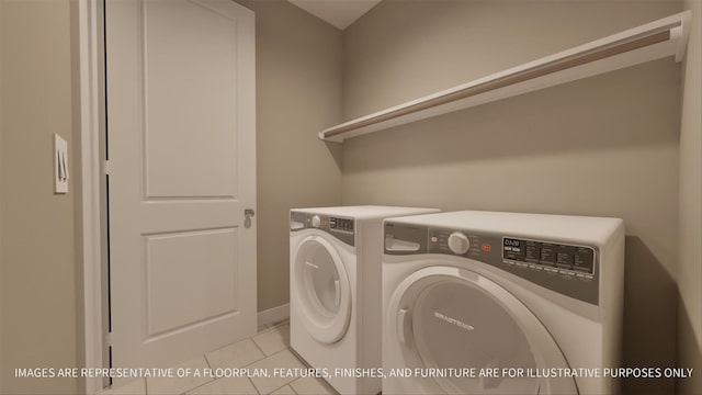 laundry room with washing machine and clothes dryer and light tile patterned floors