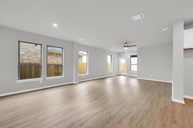 unfurnished living room with visible vents, baseboards, ceiling fan, recessed lighting, and light wood-style flooring