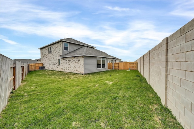 view of yard with a fenced backyard