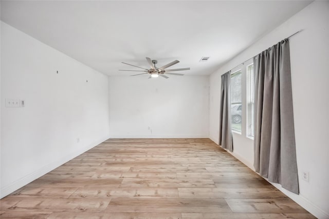 unfurnished room with ceiling fan and light hardwood / wood-style flooring