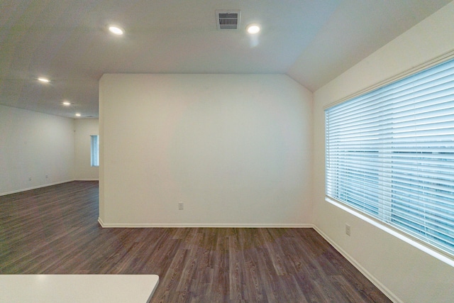 empty room featuring dark hardwood / wood-style flooring