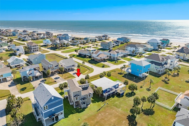 bird's eye view with a water view and a view of the beach