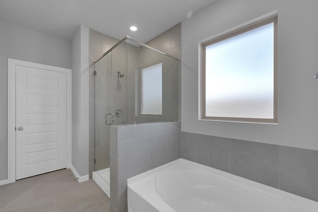 full bathroom featuring a garden tub, tile patterned floors, recessed lighting, and a shower stall