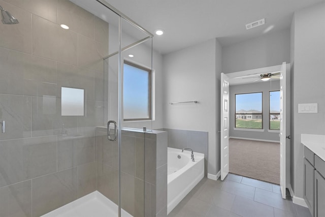 bathroom with vanity, visible vents, a shower stall, a garden tub, and tile patterned floors