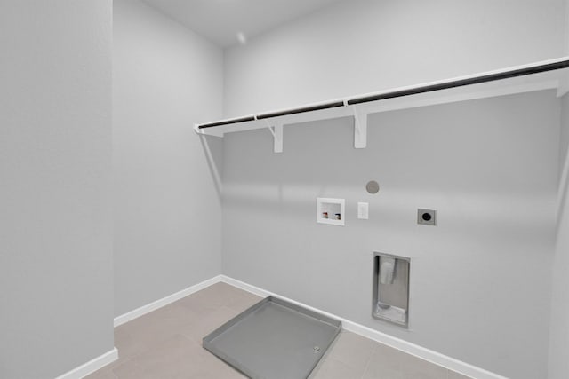 washroom with washer hookup, hookup for a gas dryer, baseboards, hookup for an electric dryer, and laundry area