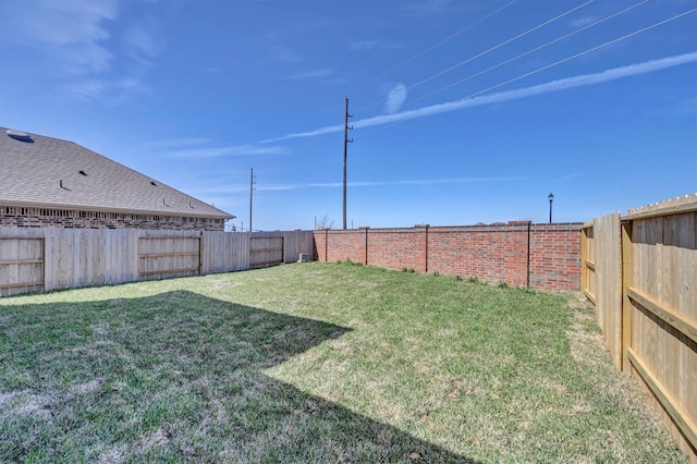 view of yard featuring a fenced backyard