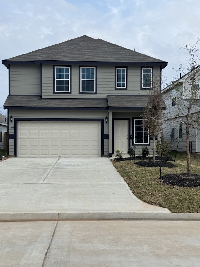 front of property with a garage