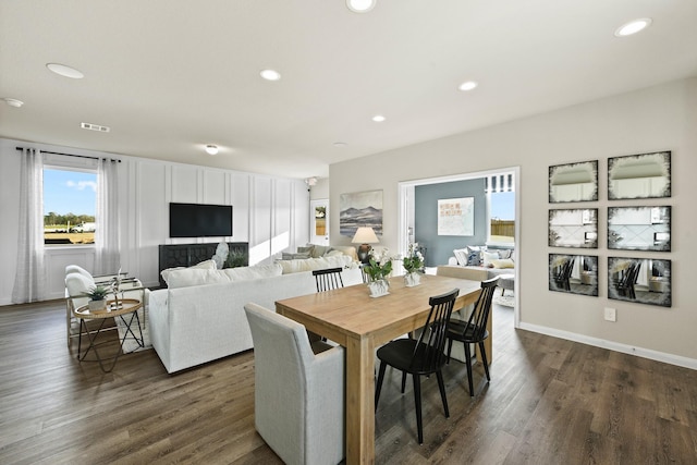 dining space with dark hardwood / wood-style floors