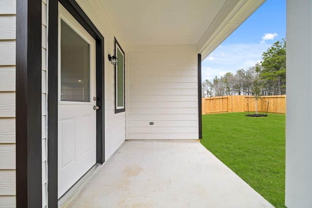 view of patio featuring fence