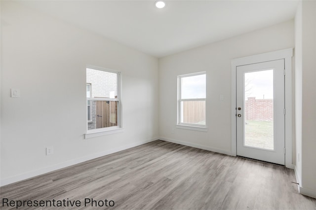 empty room featuring light hardwood / wood-style floors